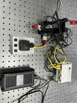 New Focus 8750 3-AXIS Picomotor W/ 8754 Joystick 9064 Actuators Tested. Fixed Price $1485.00.