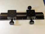 Edmund Optics Long Travel Rack & Pinion + Two Carriers ; 250MM One Knob. Fixed Price $249.91.